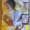 The photo shows a package with footwear in the category SM.