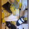 The photo shows a package with footwear in the category SM.
