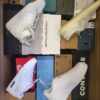 The photo shows a package with footwear in the category BS.
