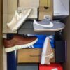 The photo shows a package with footwear in the category BS.