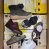 The photo shows a package with footwear in the category SM.