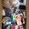 The photo shows a package with clothing in the category AU.
