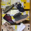 The photo shows a package with footwear in the category SM.