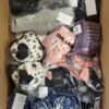 The photo shows a package with clothing in the category AU.