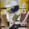 The photo shows a package with footwear in the category SM.
