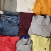 The photo shows a package with clothing in the category TSC.
