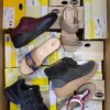 The photo shows a package with footwear in the category SM.