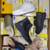 The photo shows a package with footwear in the category SM.