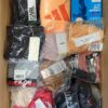 The photo shows a package with clothing in the category AU.