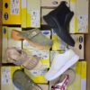 The photo shows a package with footwear in the category SM.