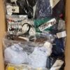 The photo shows a package with clothing in the category AU.
