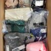 The photo shows a package with clothing in the category AU.
