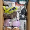 The photo shows a package with clothing in the category AU.