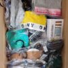 The photo shows a package with clothing in the category AU.