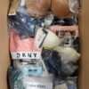 The photo shows a package with clothing in the category AU.