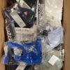 The photo shows a package with clothing in the category AU.