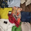The photo shows a package with clothing in the category TSC.