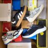 The photo shows a package with footwear in the category CS.