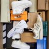 The photo shows a package with footwear in the category CS.
