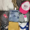 The photo shows a package with clothing in the category TSC.