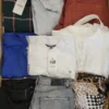 The photo shows a package with clothing in the category TSC.