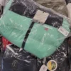 The photo shows a package with clothing in the category AJW.