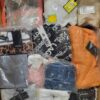 The photo shows a package with clothing in the category K.