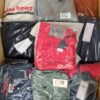 The photo shows a package with clothing in the category AM.