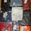 The photo shows a package with clothing in the category AM.