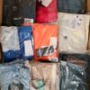 The photo shows a package with clothing in the category AM.