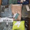The photo shows a package with clothing in the category AM.