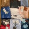 The photo shows a package with clothing in the category AM.