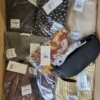The photo shows a package with clothing in the category YA.