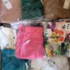 The photo shows a package with clothing in the category AR.