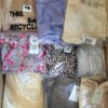 The photo shows a package with clothing in the category AR.