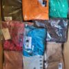 The photo shows a package with clothing in the category AR.