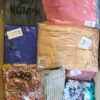The photo shows a package with clothing in the category AR.