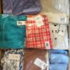 The photo shows a package with clothing in the category AR.