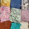 The photo shows a package with clothing in the category SN.