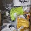 The photo shows a package with clothing in the category AW.