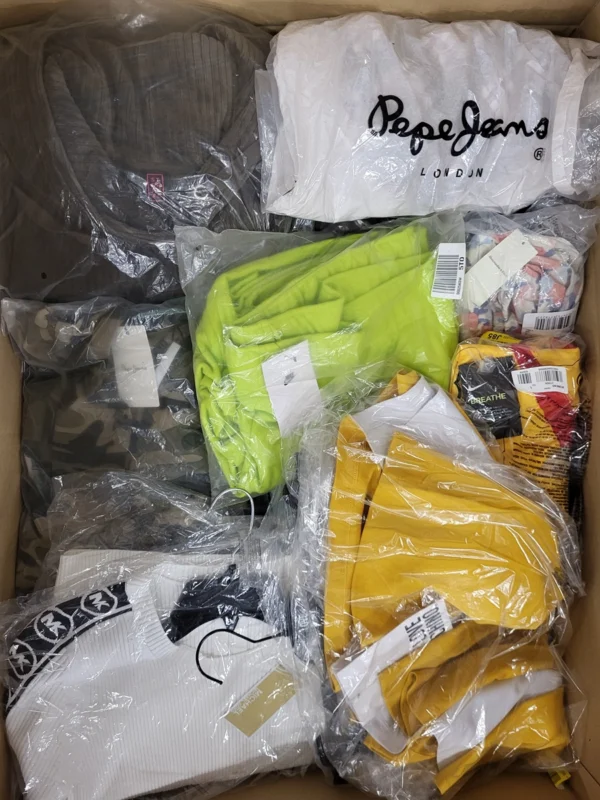 The photo shows a package with clothing in the category AW.