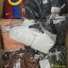 The photo shows a package with clothing in the category AW.