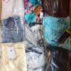 The photo shows a package with clothing in the category AW.