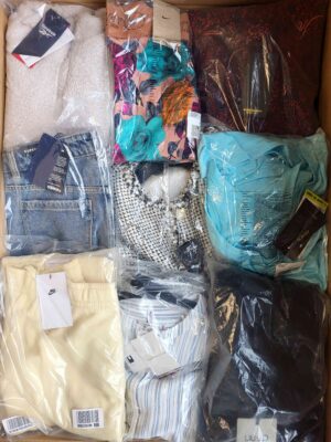 The photo shows a package with clothing in the category AW.