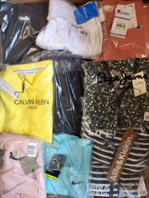 The photo shows a package with clothing in the category AW.