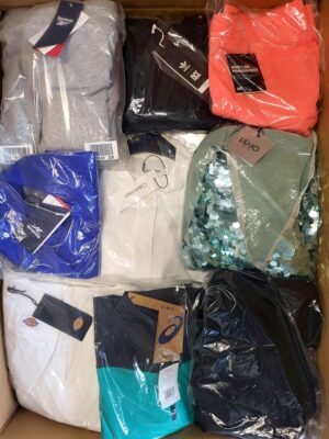 The photo shows a package with clothing in the category AW.