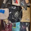 The photo shows a package with clothing in the category AW.