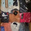 The photo shows a package with clothing in the category AW.
