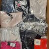 The photo shows a package with clothing in the category AW.