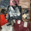 The photo shows a package with clothing in the category AW.